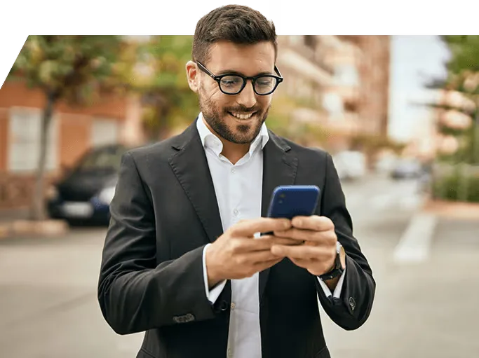 A trader checking crypto prices on his phone in the street